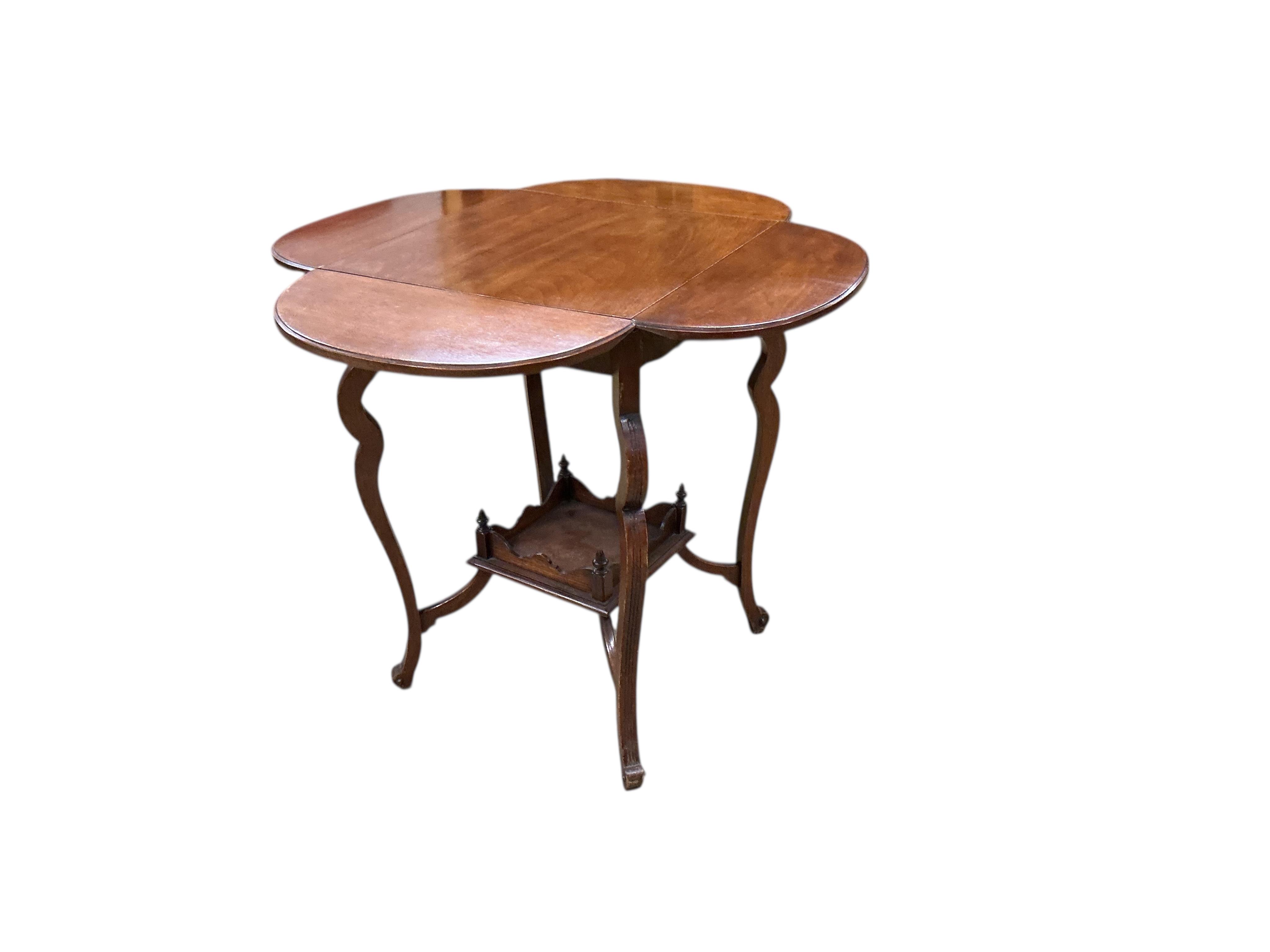 A late Victorian walnut drop flap centre table, width 45cm, height 68cm